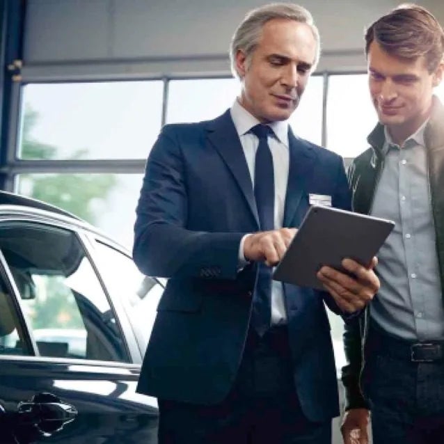 Image of BMW representative speaking with a customer