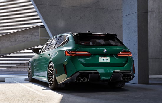 Green BMW M5 Touring parked in garage. | Newbold BMW in O Fallon IL