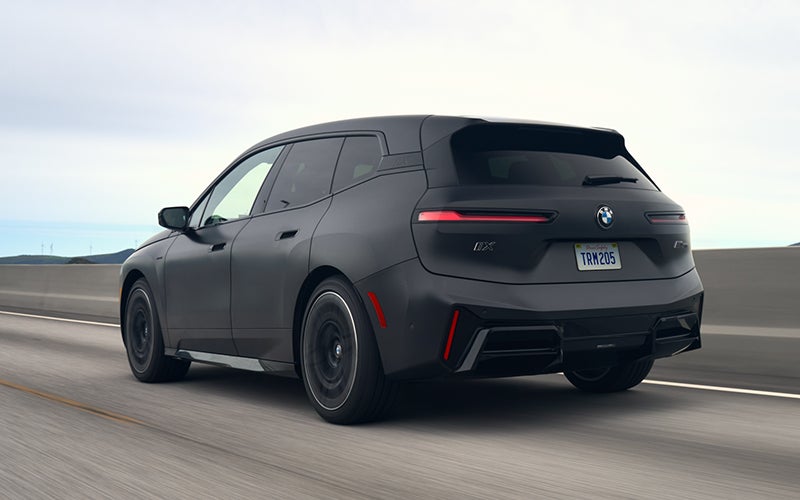 The BMW iX M70 driving rear shot. | Newbold BMW in O Fallon IL