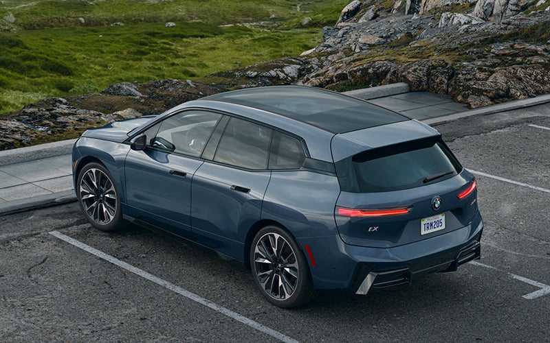 The BMW iX parked in a parking spot. | Newbold BMW in O Fallon IL