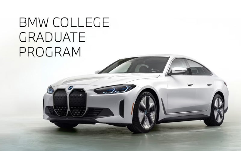White BMW i4 parked. BMW College Graduate Program. | Newbold BMW in O Fallon IL