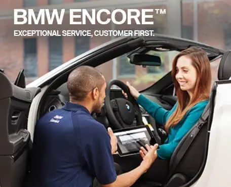 BMW Encore with service expert and customer